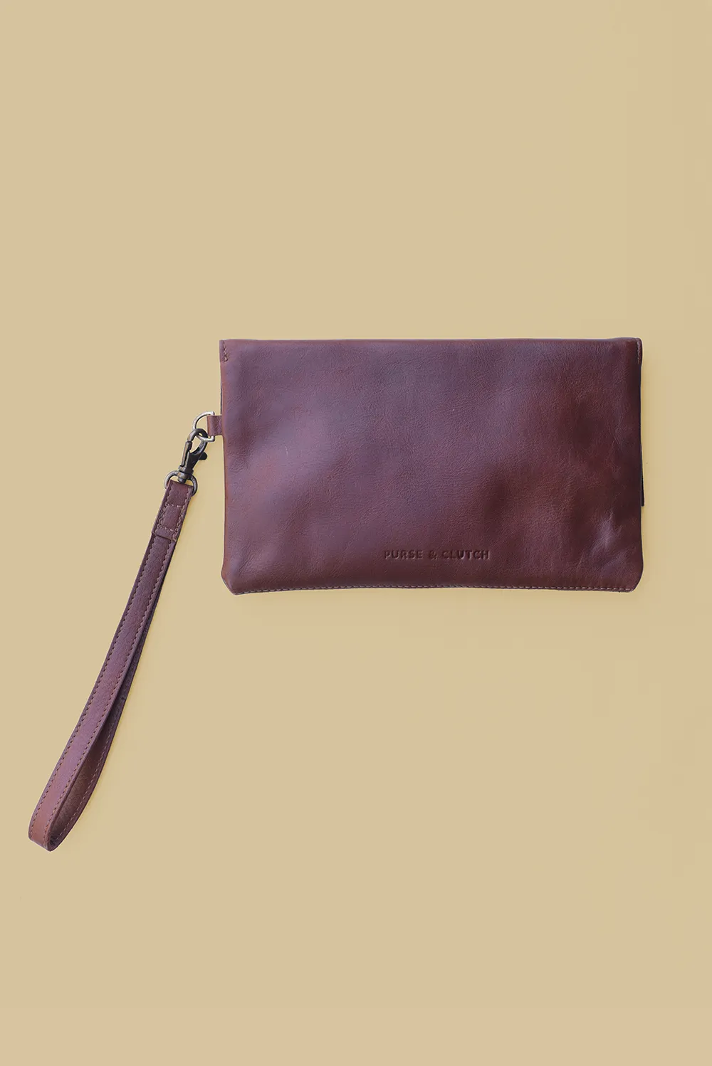 Leather Asymmetric Clutch with Wristlet Strap in Chestnut Brown