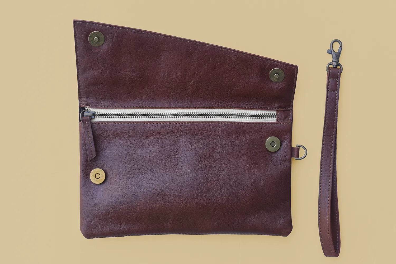Leather Asymmetric Clutch with Wristlet Strap in Chestnut Brown