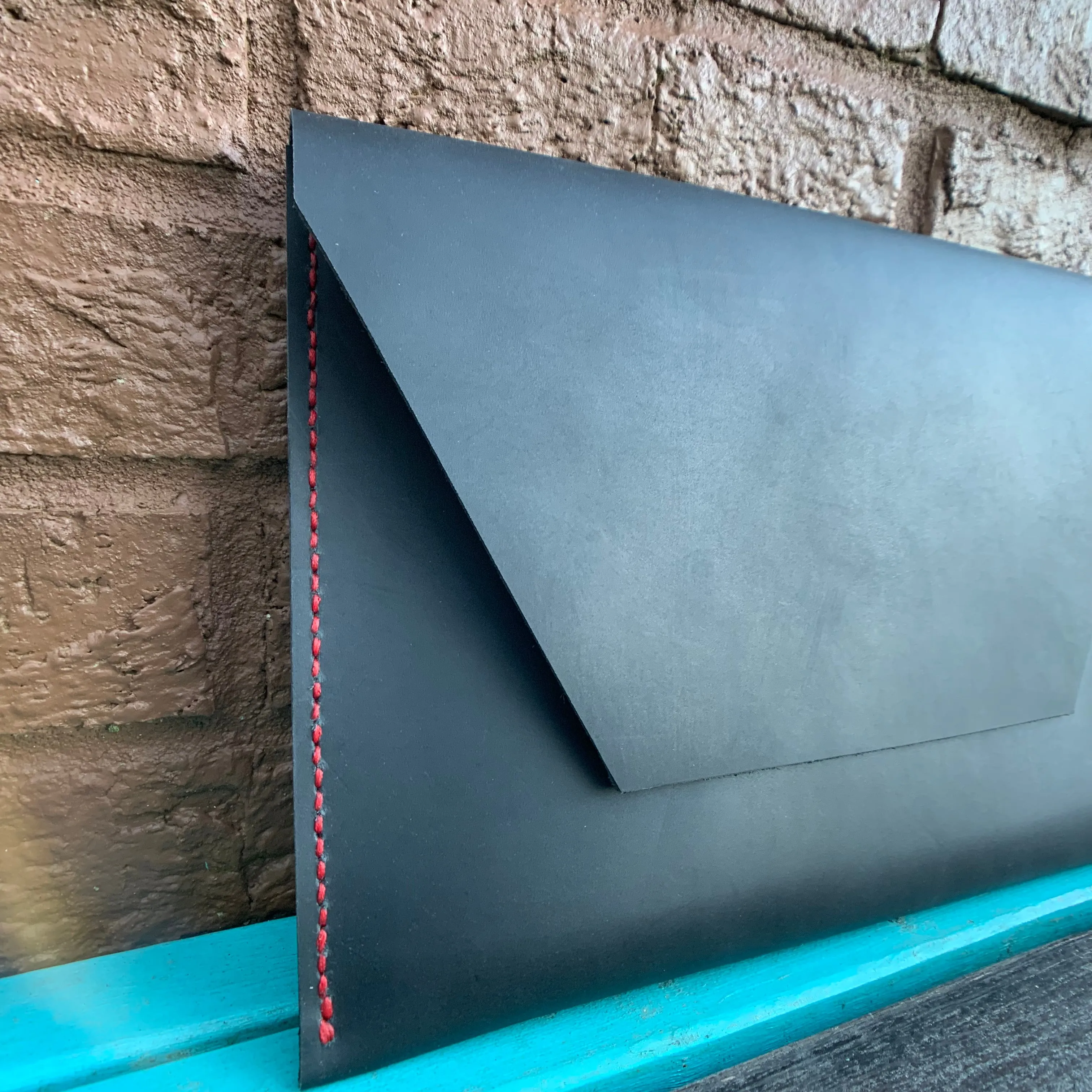 “The Carl” in Midnight Black Oil Tanned Leather with Red Stitching